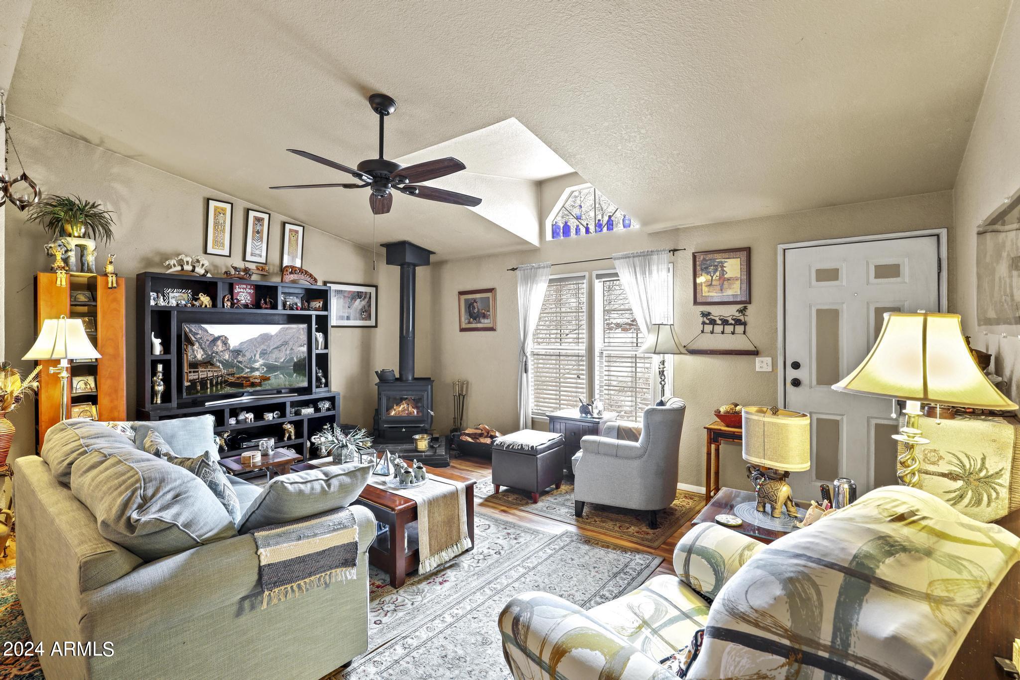 308 East Cherry Street Payson, AZ 85541 - Photo 3 of 22 a living room with furniture a ceiling fan and a window