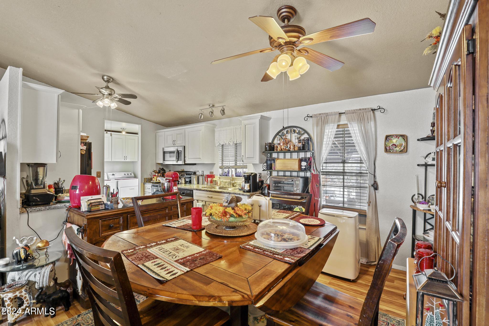 308 East Cherry Street Payson, AZ 85541 - Photo 7 of 22 a view of a dining room with furniture and a chandelier