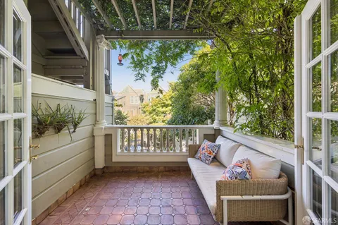 a spacious bedroom with a bed and a fireplace