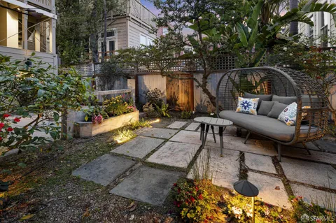 a bedroom with a bed and a lamp on table