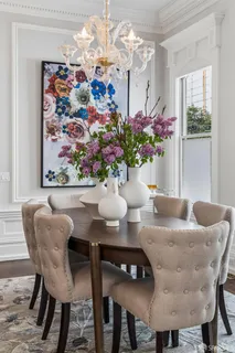a view of a chairs and table in a backyard