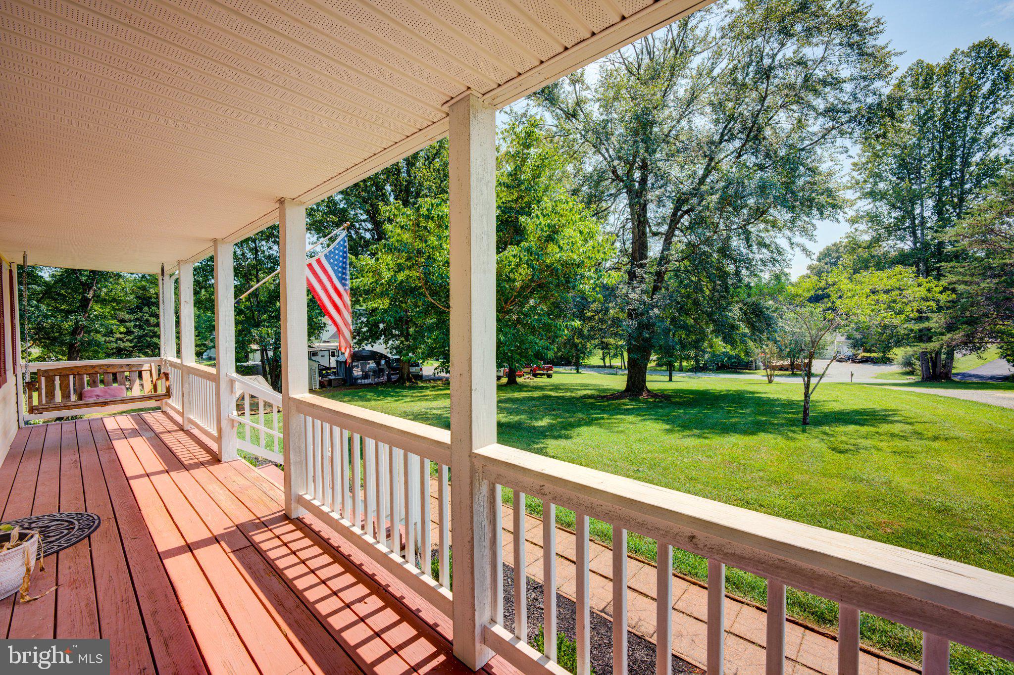 9595 Roys Lane Culpeper, VA 22701 - Photo 2 of 61 Charming porch with lush greenery.