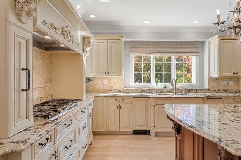 85 Colts Crossing Canton, MA 02021 - Photo 11 of 38 a kitchen with granite countertop a sink stove and cabinets