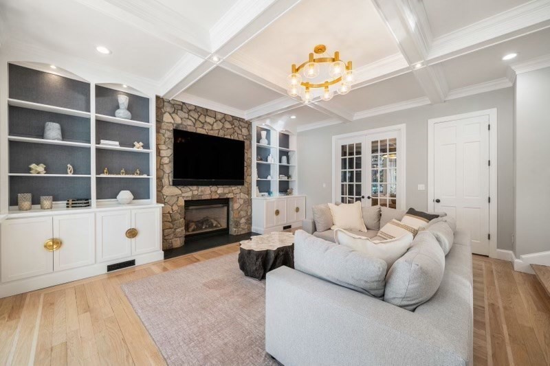 85 Colts Crossing Canton, MA 02021 - Photo 13 of 38 a living room with furniture a fireplace and a flat screen tv