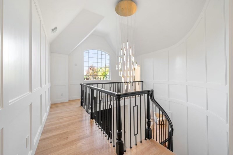 85 Colts Crossing Canton, MA 02021 - Photo 25 of 38 a view of staircase with railing and white walls