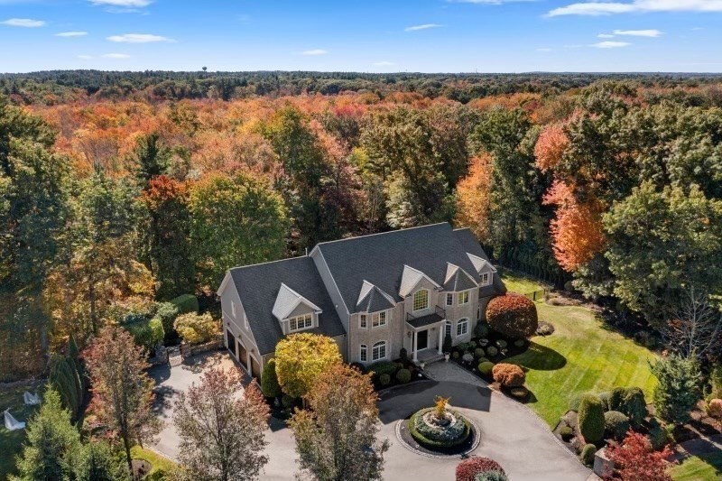 85 Colts Crossing Canton, MA 02021 - Photo 3 of 38 an aerial view of a house with garden space and outdoor seating