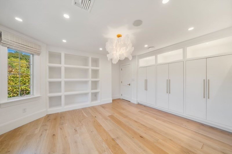 85 Colts Crossing Canton, MA 02021 - Photo 32 of 38 wooden floor in an empty room with a window