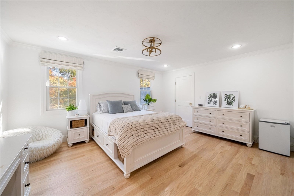 85 Colts Crossing Canton, MA 02021 - Photo 35 of 38 a bedroom with a bed and wooden floor
