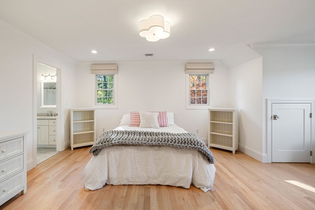 85 Colts Crossing Canton, MA 02021 - Photo 36 of 38 a spacious bedroom with a bed and a view of kitchen