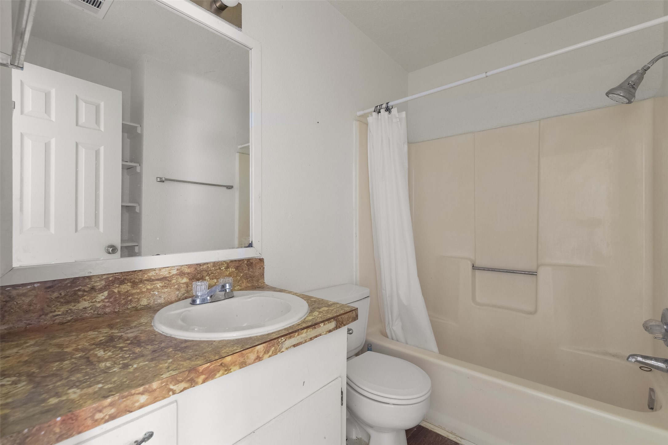 217 Lazy Lane, Unit B Conroe, TX 77301 - Photo 12 of 27 a bathroom with a sink toilet and shower