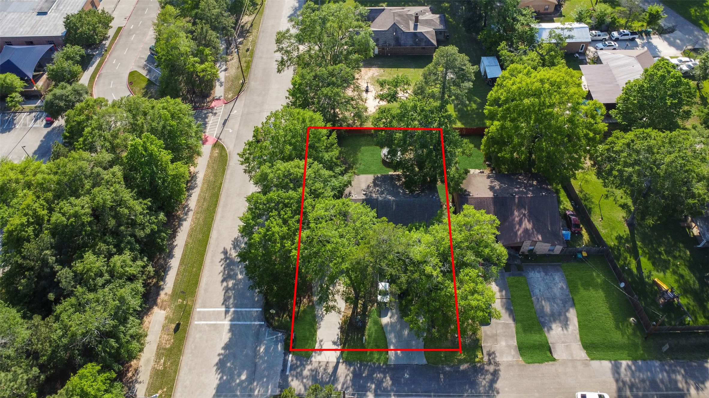 217 Lazy Lane, Unit B Conroe, TX 77301 - Photo 27 of 27 an aerial view of residential houses with outdoor space