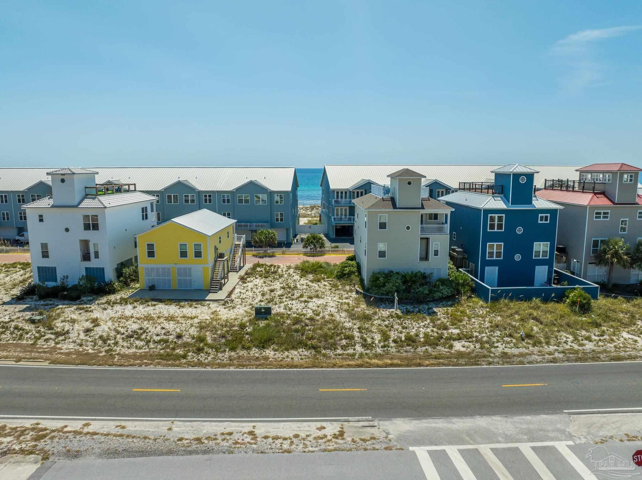 521 Fort Pickens Road Pensacola Beach, FL 32561 - Photo 12 of 20 an aerial view of a house with a yard