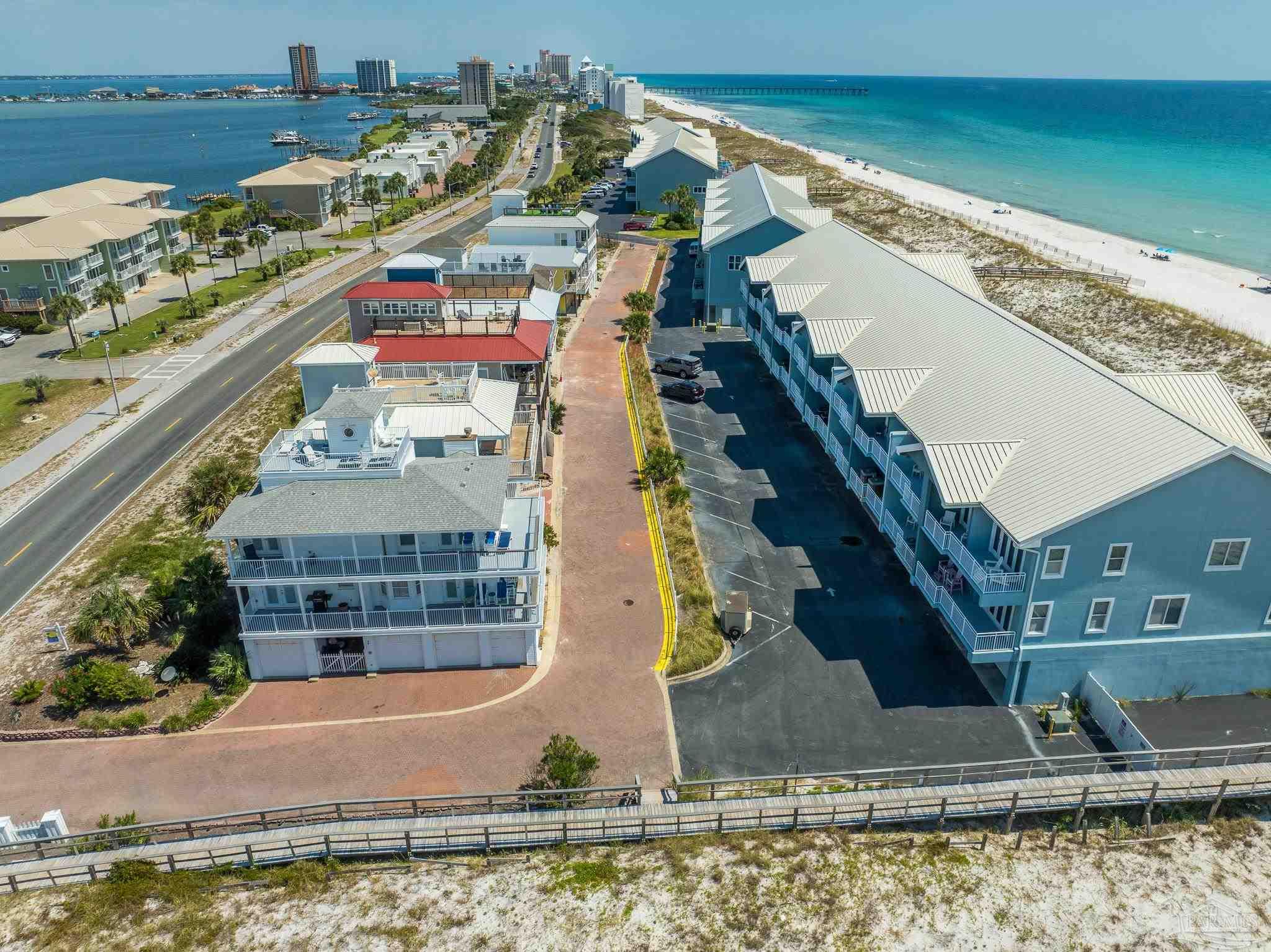 521 Fort Pickens Road Pensacola Beach, FL 32561 - Photo 19 of 20 a view of a water with a building in the background