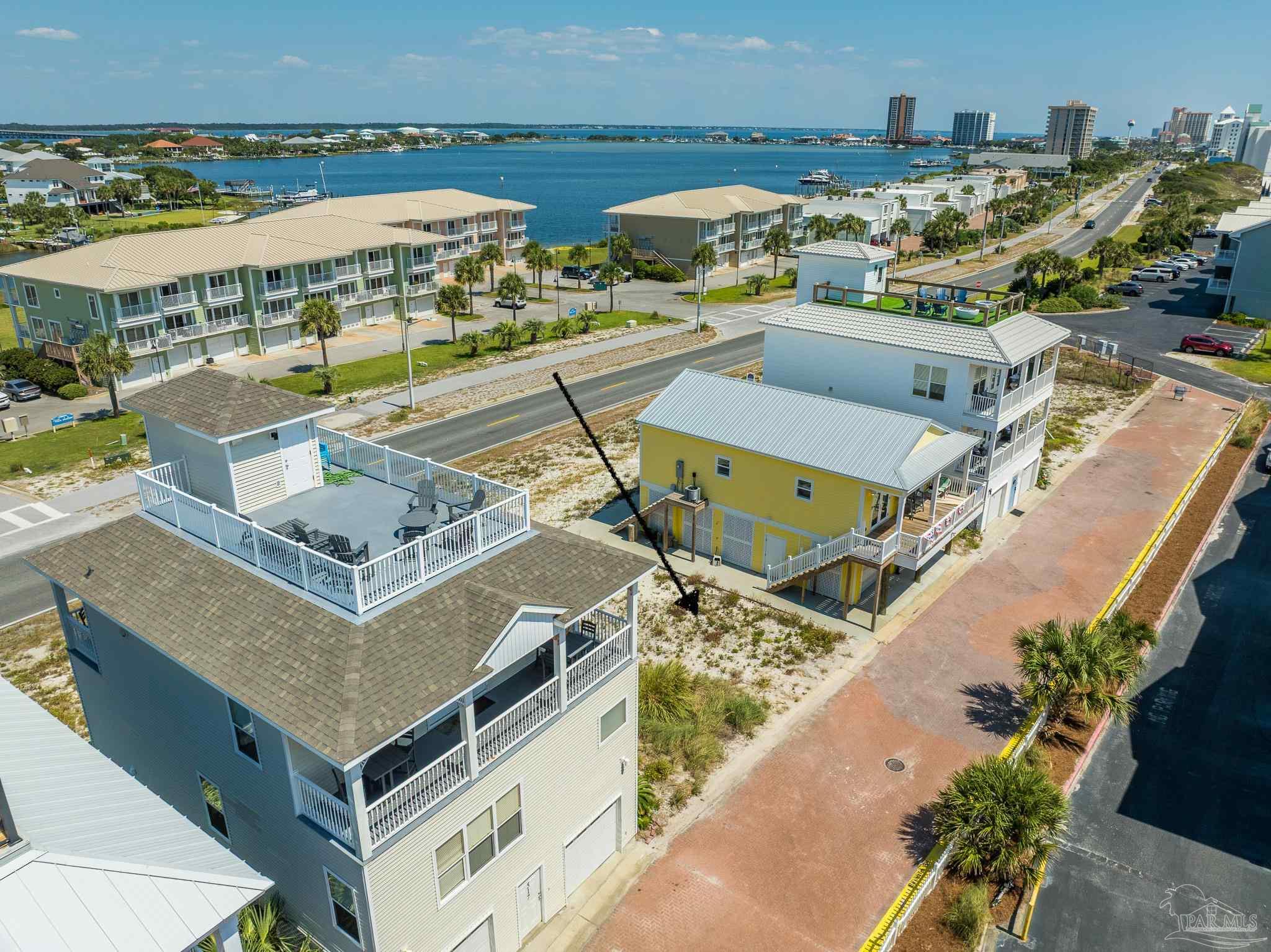 521 Fort Pickens Road Pensacola Beach, FL 32561 - Photo 7 of 20 a view of a city with an ocean