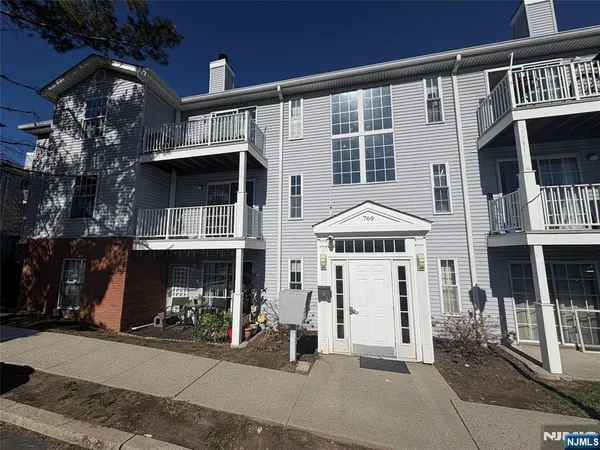 a view of a house with a street