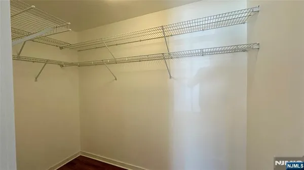 a bathroom with a double vanity sink mirror and toilet