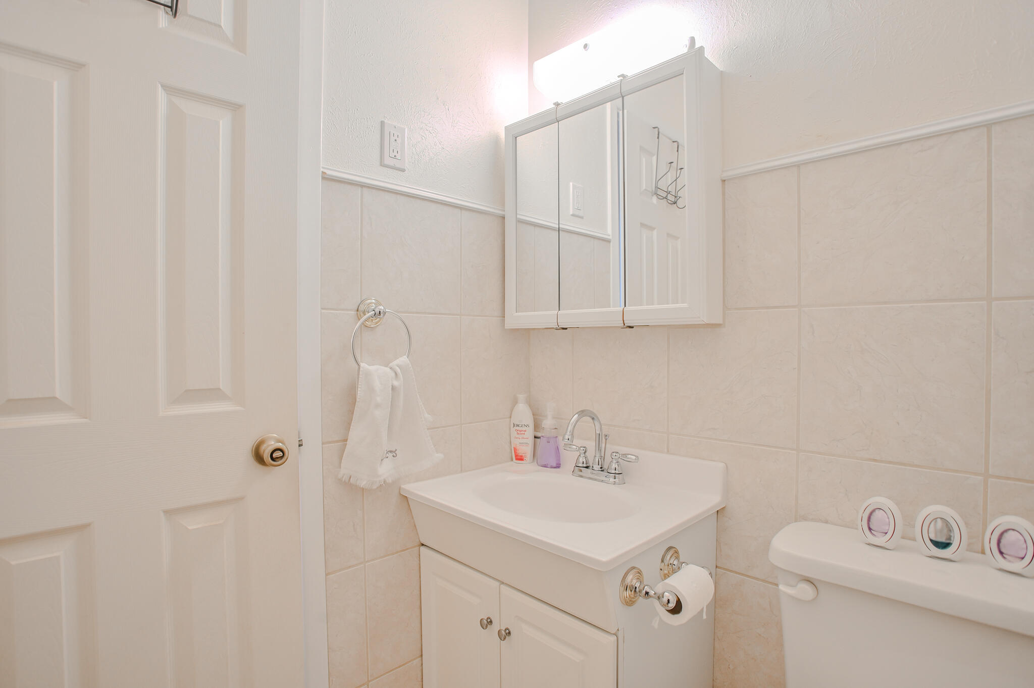 720 South 23rd Street Slaton, TX 79364 - Photo 11 of 46 a bathroom with a sink a toilet and vanity