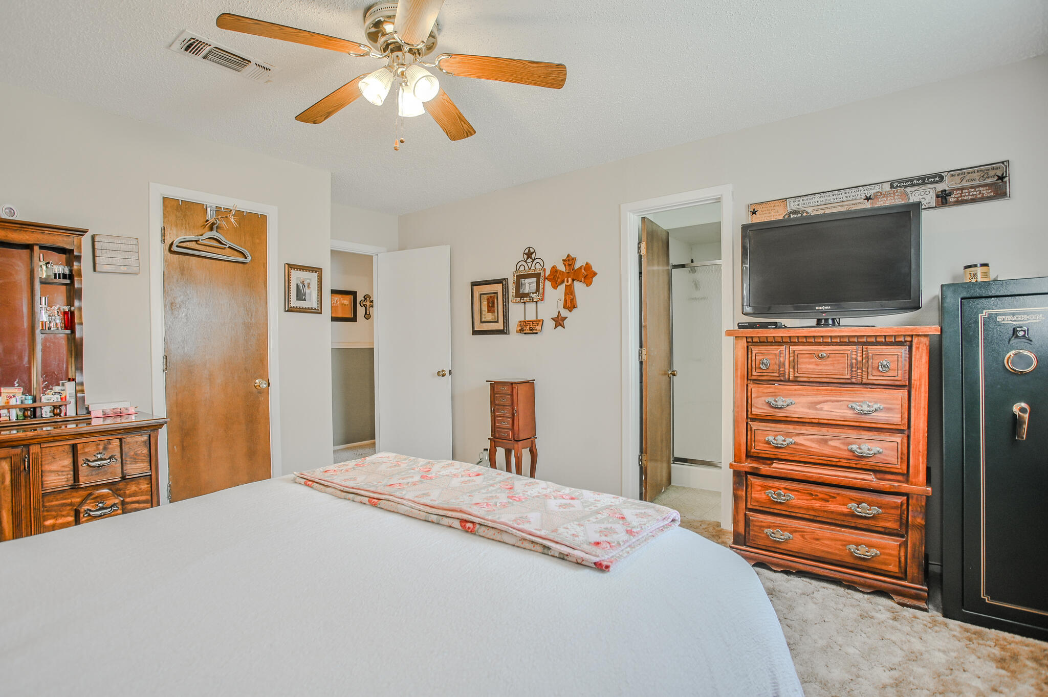 720 South 23rd Street Slaton, TX 79364 - Photo 17 of 46 a bedroom with a bed and a flat screen tv