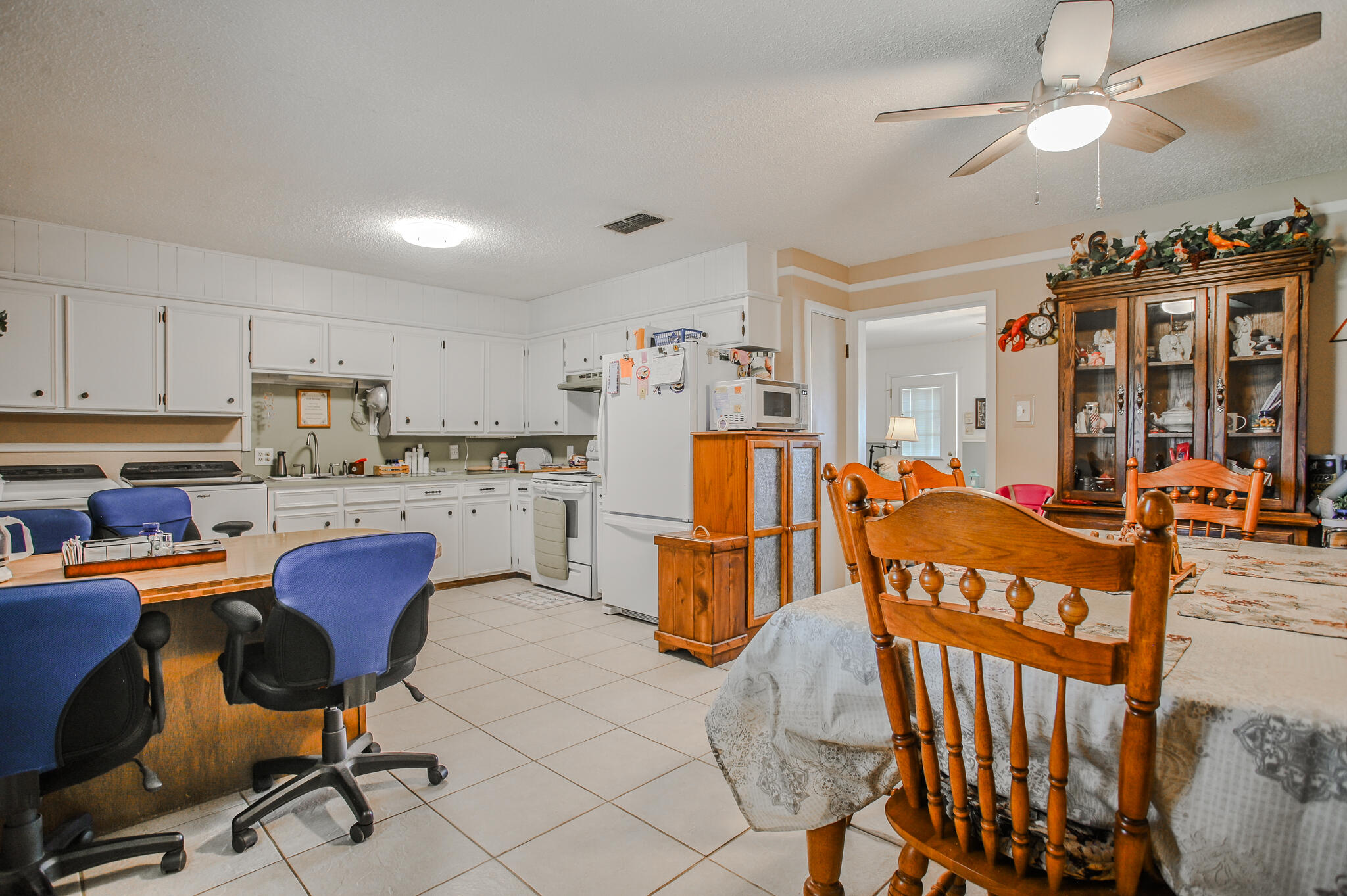 720 South 23rd Street Slaton, TX 79364 - Photo 24 of 46 a view of a kitchen and dining room