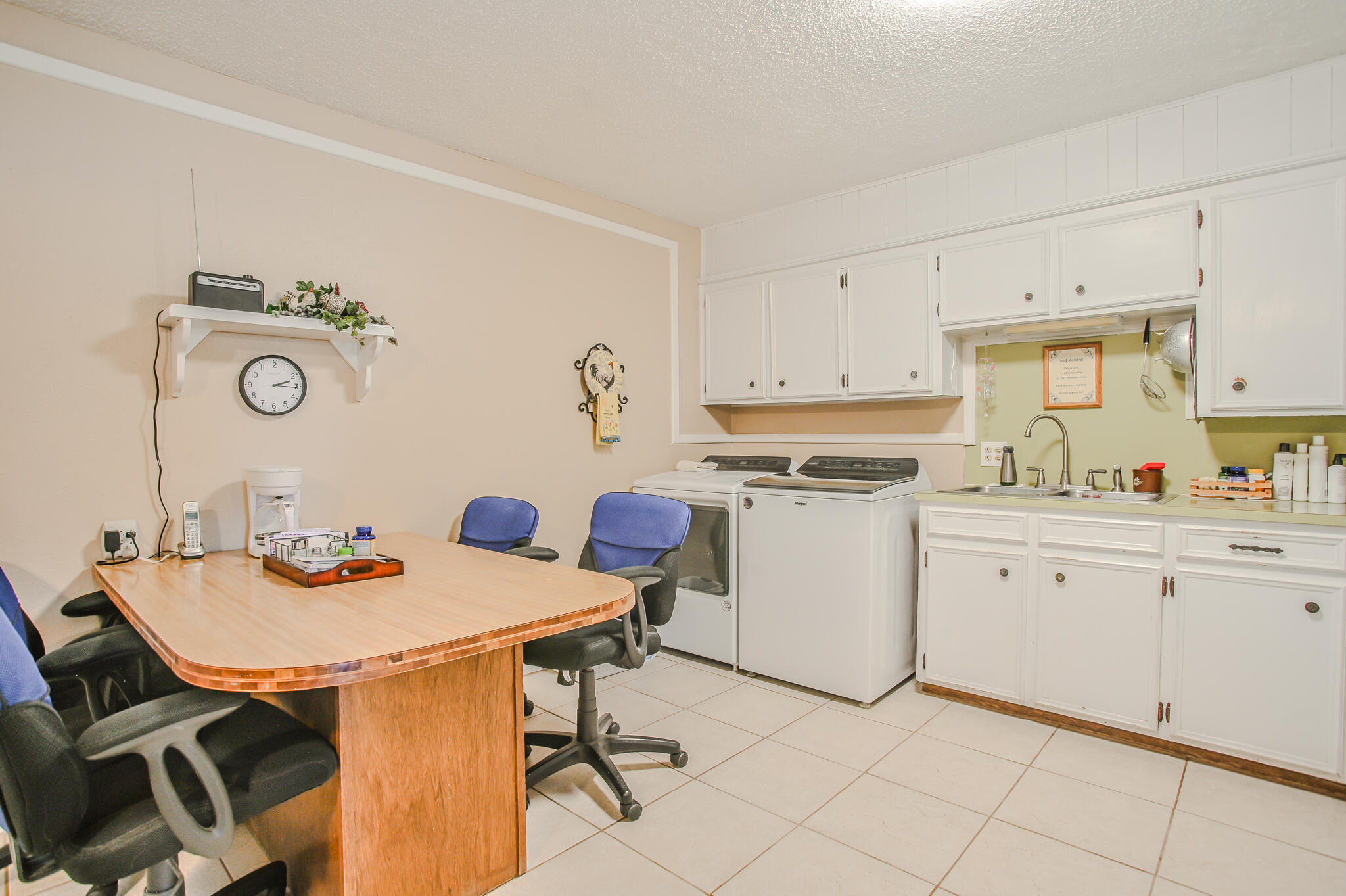 720 South 23rd Street Slaton, TX 79364 - Photo 28 of 46 a view of kitchen with cabinets table and chairs