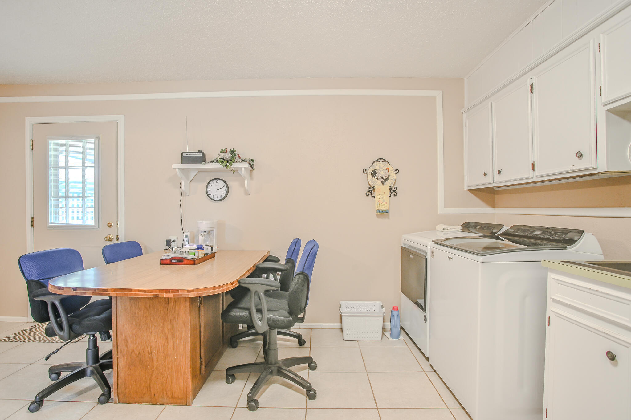 720 South 23rd Street Slaton, TX 79364 - Photo 30 of 46 a view of a dining room with furniture and a chandelier