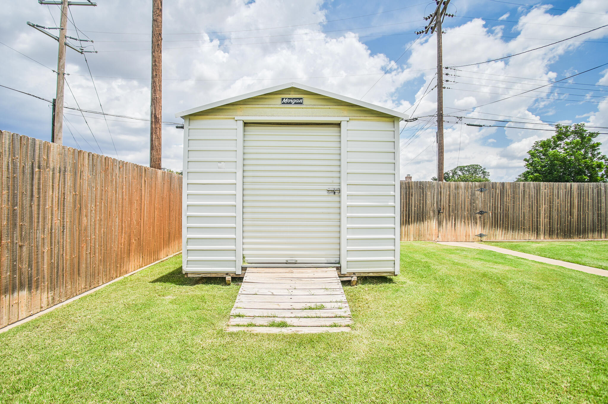 720 South 23rd Street Slaton, TX 79364 - Photo 38 of 46 a front view of a house with a garden