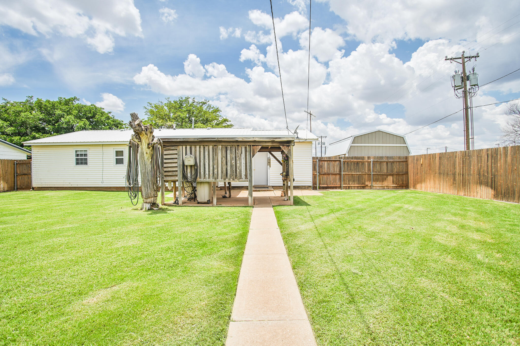 720 South 23rd Street Slaton, TX 79364 - Photo 40 of 46 a view of a house with a swimming pool