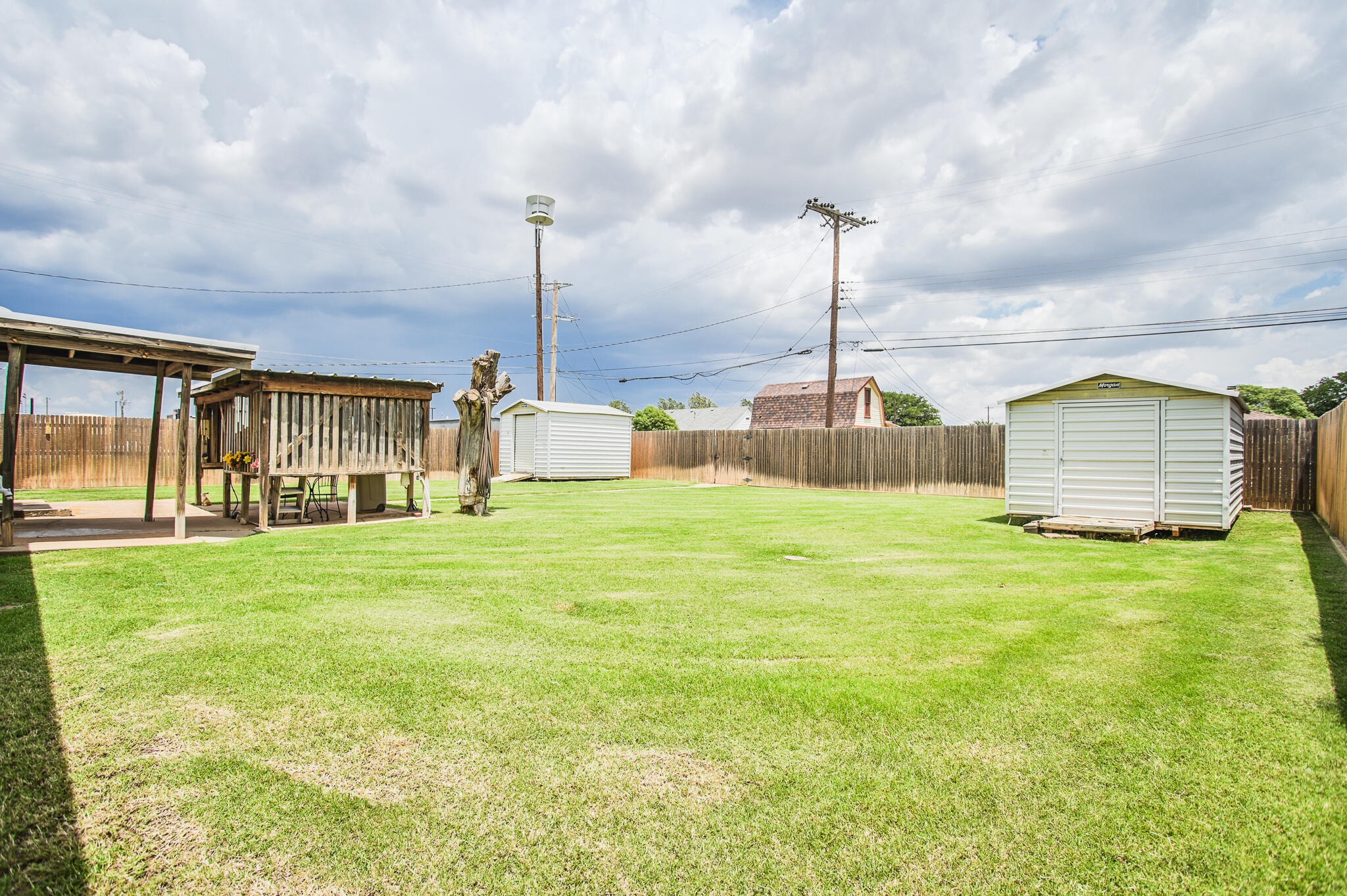 720 South 23rd Street Slaton, TX 79364 - Photo 41 of 46 a front view of a house with a garden and plants