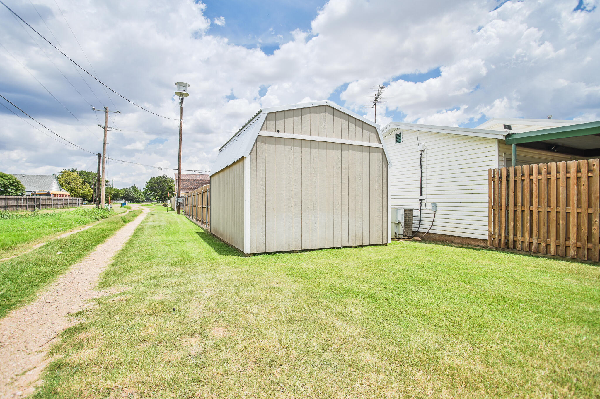 720 South 23rd Street Slaton, TX 79364 - Photo 46 of 46 a view of a garden with a slide