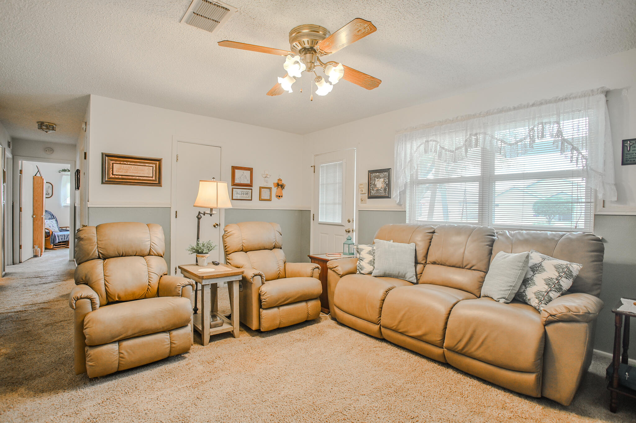 720 South 23rd Street Slaton, TX 79364 - Photo 6 of 46 a living room with furniture and a large window