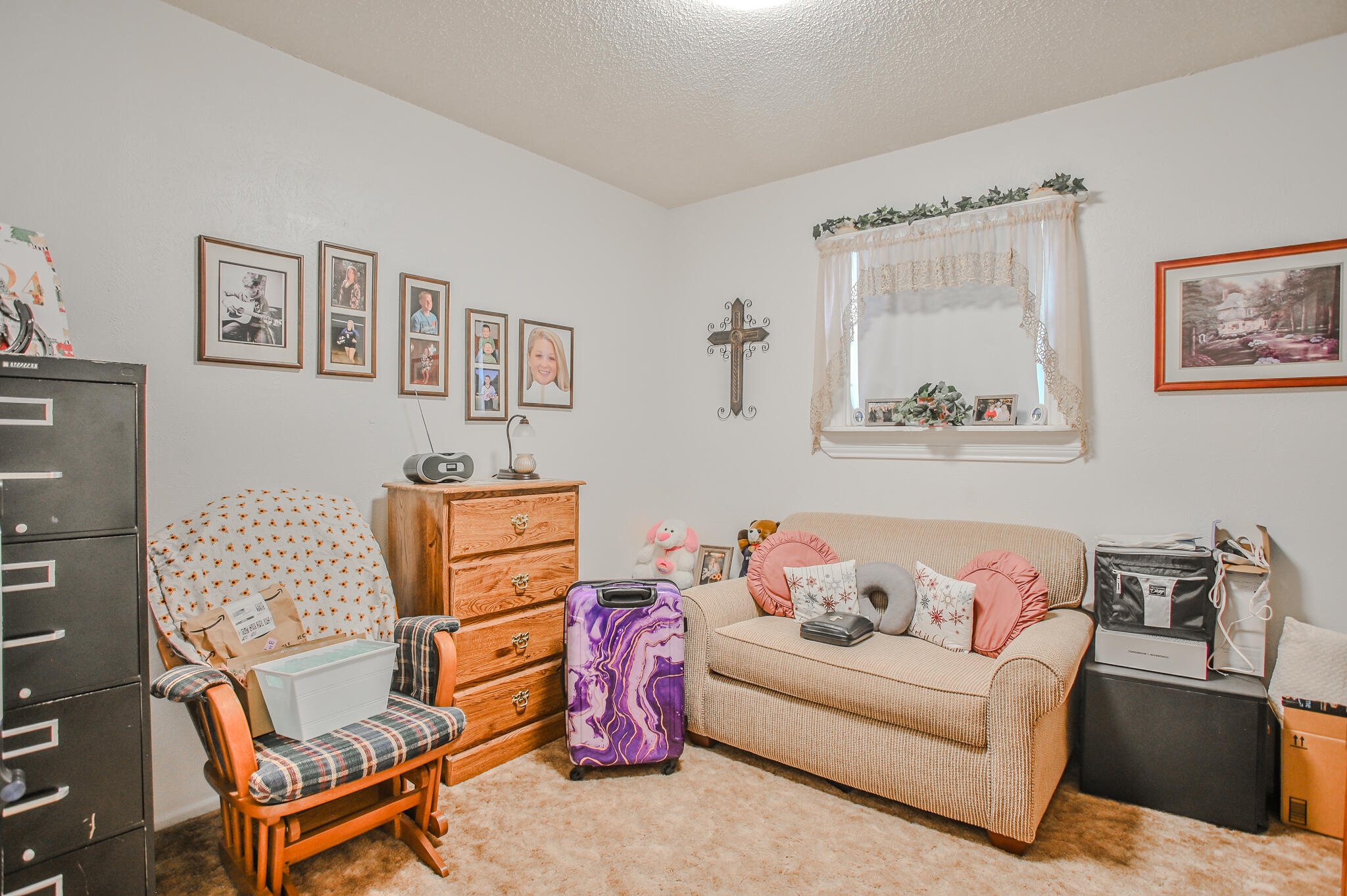 720 South 23rd Street Slaton, TX 79364 - Photo 7 of 46 a living room with furniture and a window