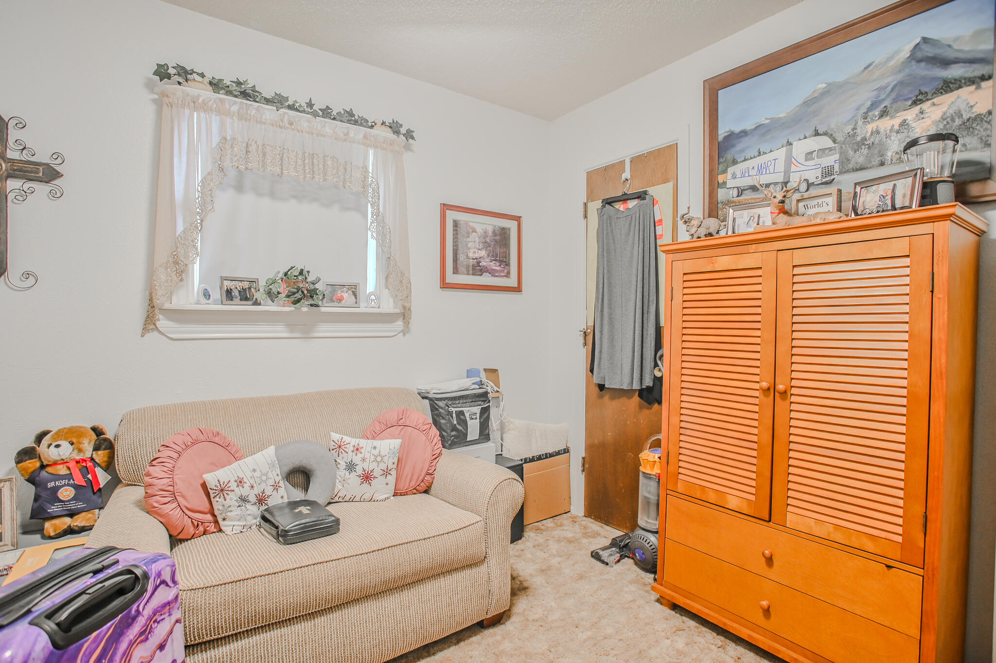 720 South 23rd Street Slaton, TX 79364 - Photo 9 of 46 a bedroom with furniture and a window