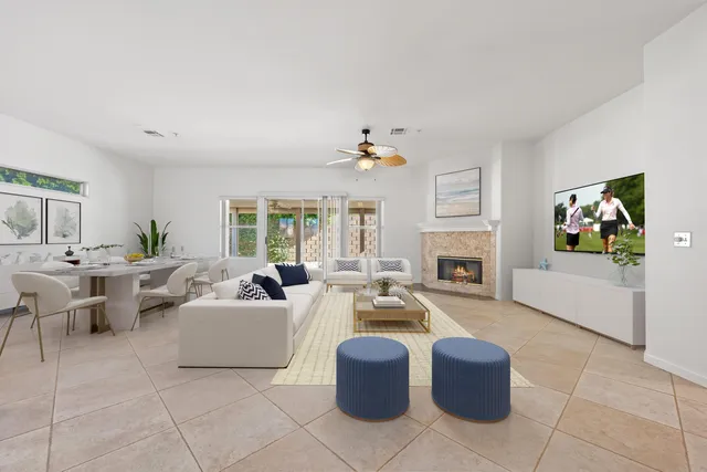 a living room with fireplace furniture and a flat screen tv