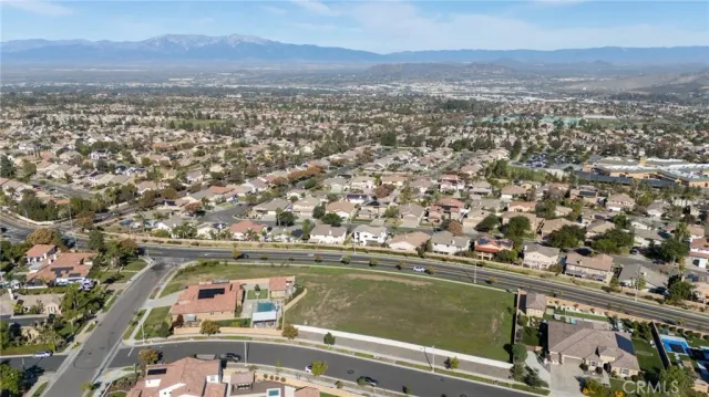 an aerial view of residential houses and outdoor space