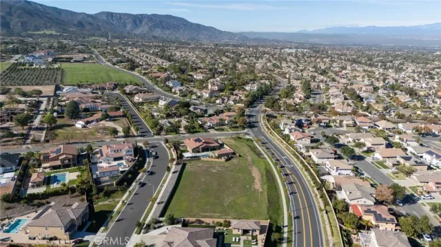 an aerial view of residential houses and outdoor space