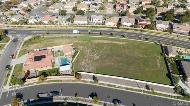 an aerial view of a residential apartment building with a yard