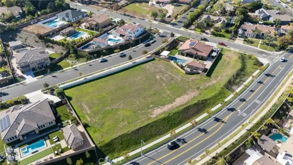 an aerial view of a residential houses with outdoor space
