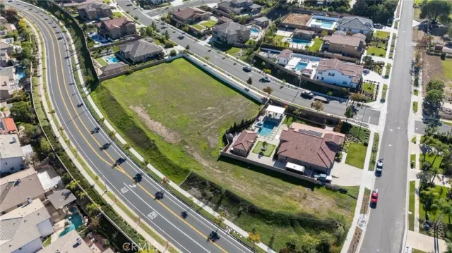 an aerial view of a residential houses with outdoor space