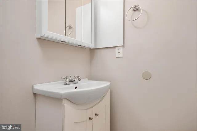 a kitchen with a sink cabinets and window