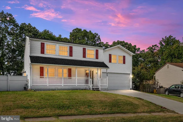 a view of a house with a backyard space