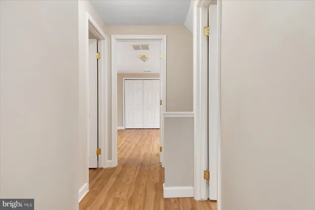 a view of a house with wooden deck
