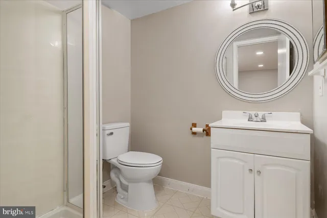 a view of a room with wooden floor and bench