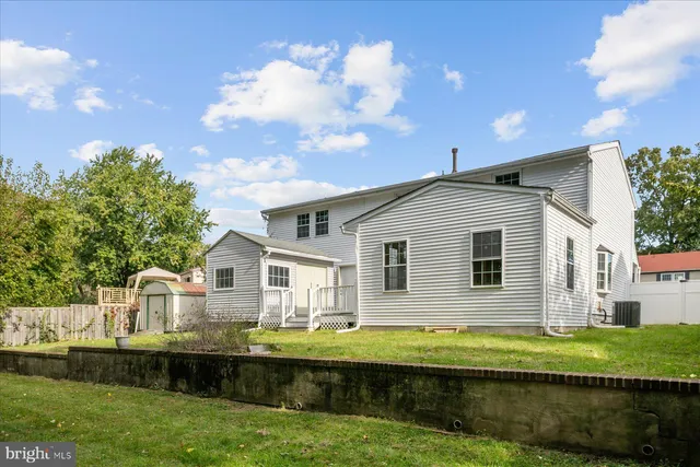 a swimming pool with an outdoor space and seating area