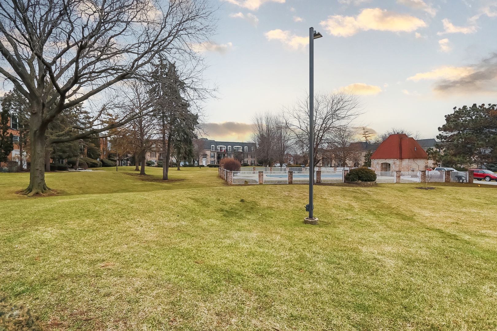 5000 Carriageway Drive, Unit 103 Rolling Meadows, IL 60008 - Photo 21 of 22 a sign board with tall trees