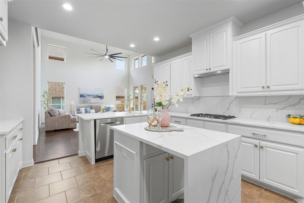 11984 Del Rio Drive Frisco, TX 75035 - Photo 2 of 38 Kitchen featuring recessed lighting, dishwasher, gas stovetop, a center island, and a ceiling fan