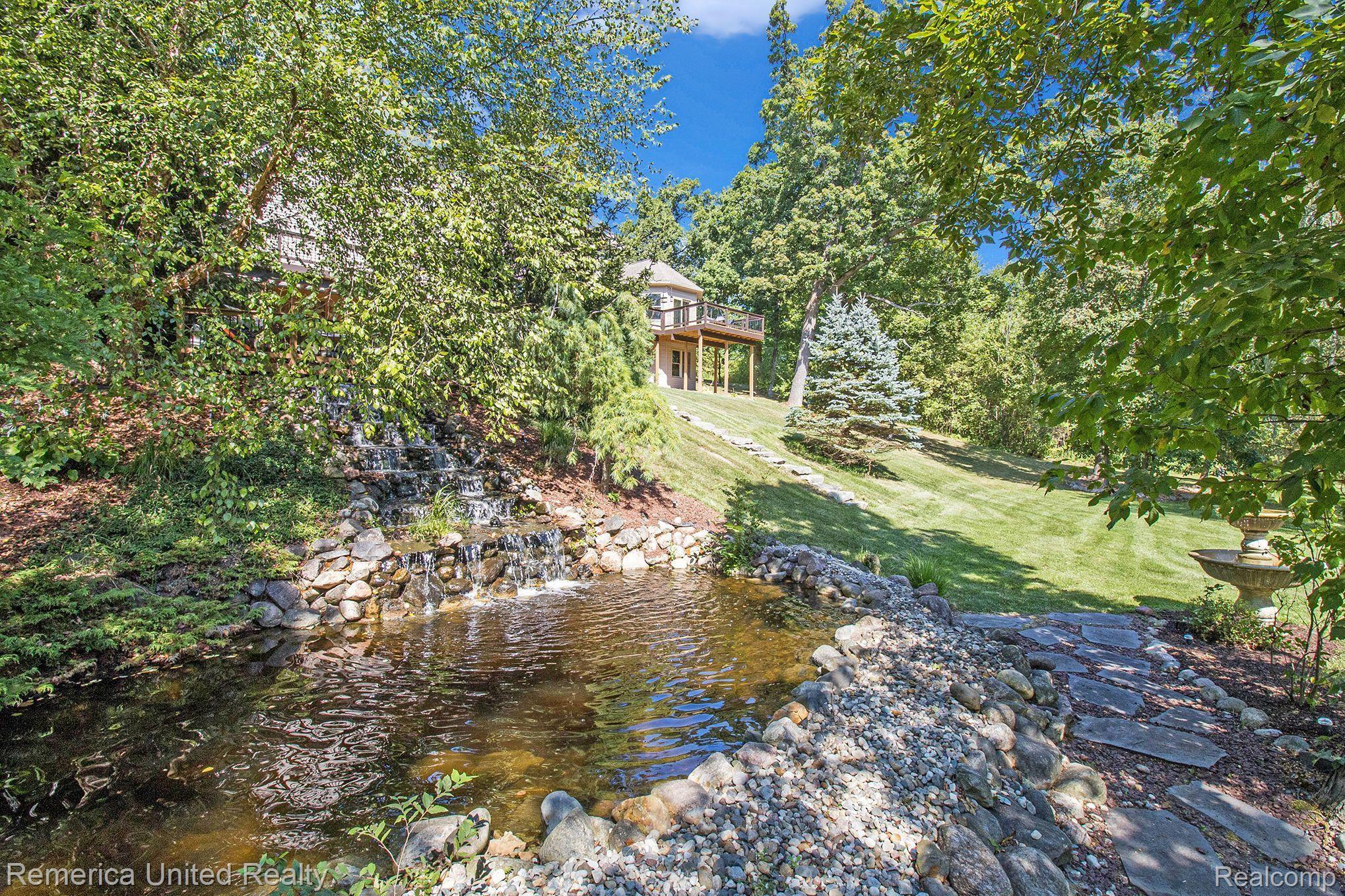 3470 East Highland Road Howell, MI 48843 - Photo 5 of 66 Waterfall & Koi Pond