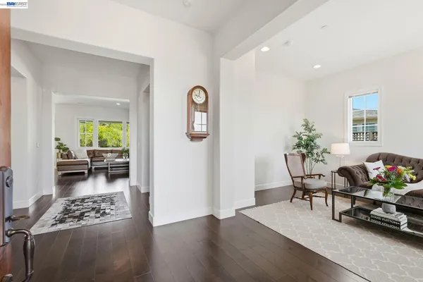 a bedroom with furniture and large windows
