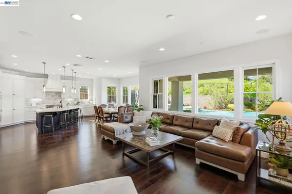 a bathroom with a double vanity sink a mirror and a bathtub