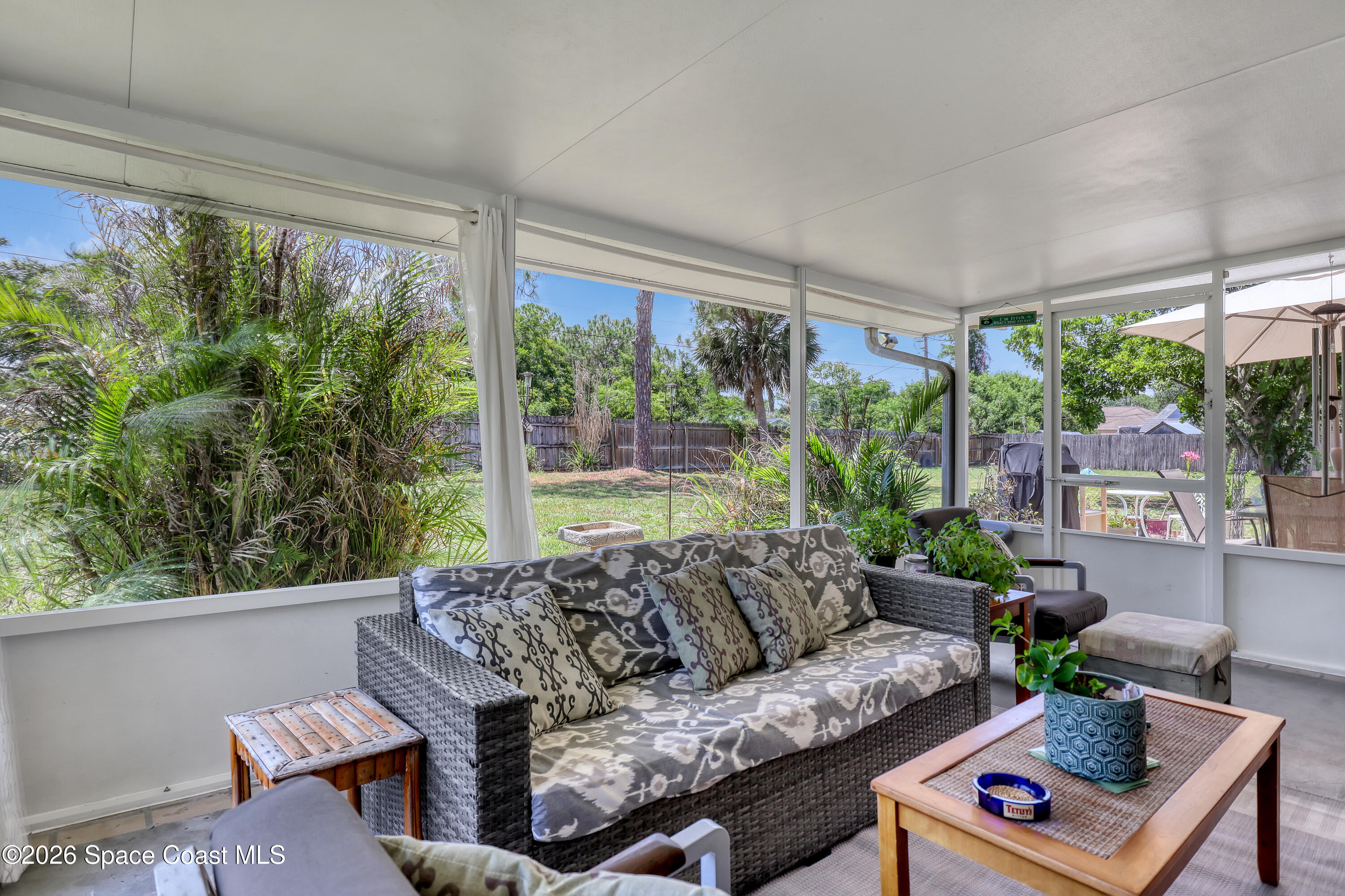 858 Carnival Road Southeast Palm Bay, FL 32909 - Photo 18 of 21 Porch to Back Yard