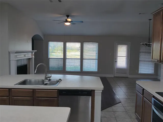 a kitchen with a sink and a window